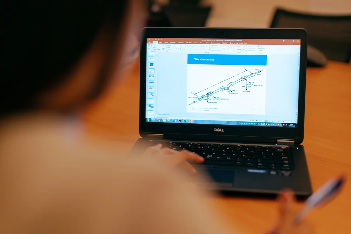 Close-up of a laptop screen while someone reviews technical information