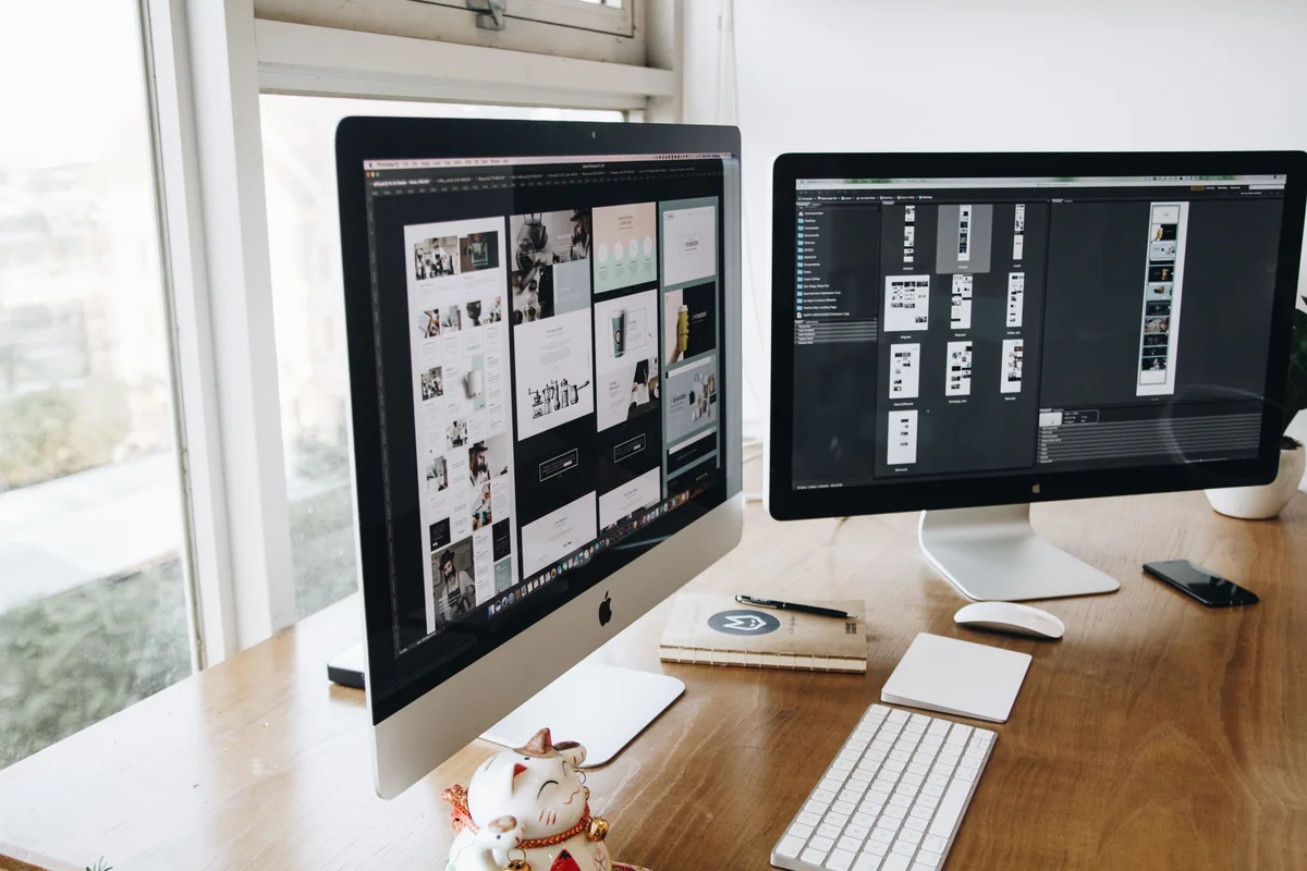 Desktop computer monitor set up on a wooden desk at home