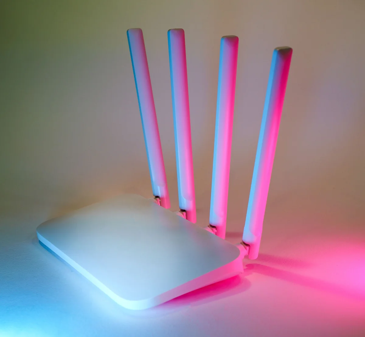 Person checking a router to troubleshoot a network connection